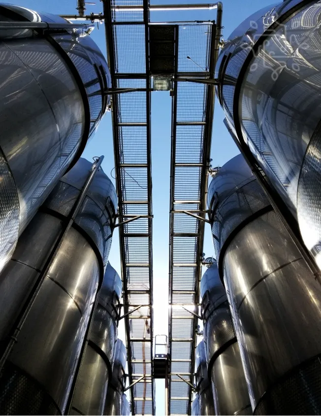 Interior view of a large metal tank showcasing its spacious, industrial design and structural features